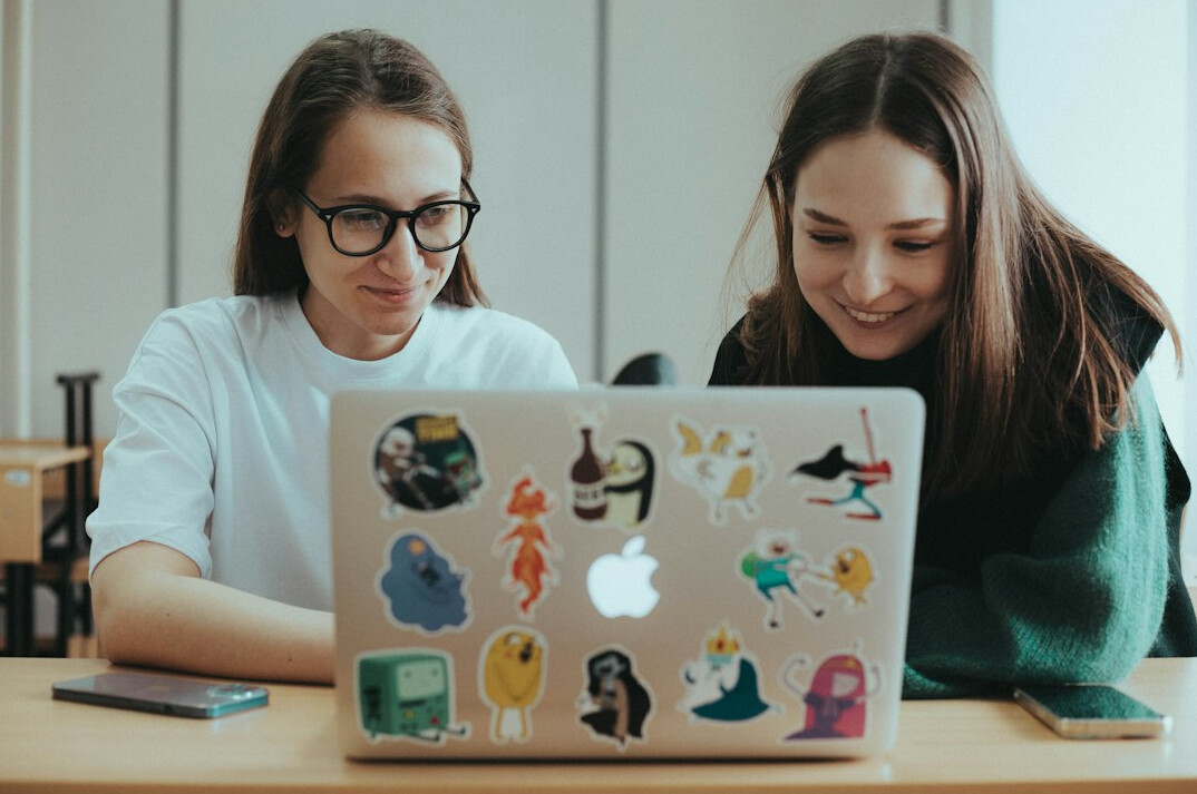 students coding together