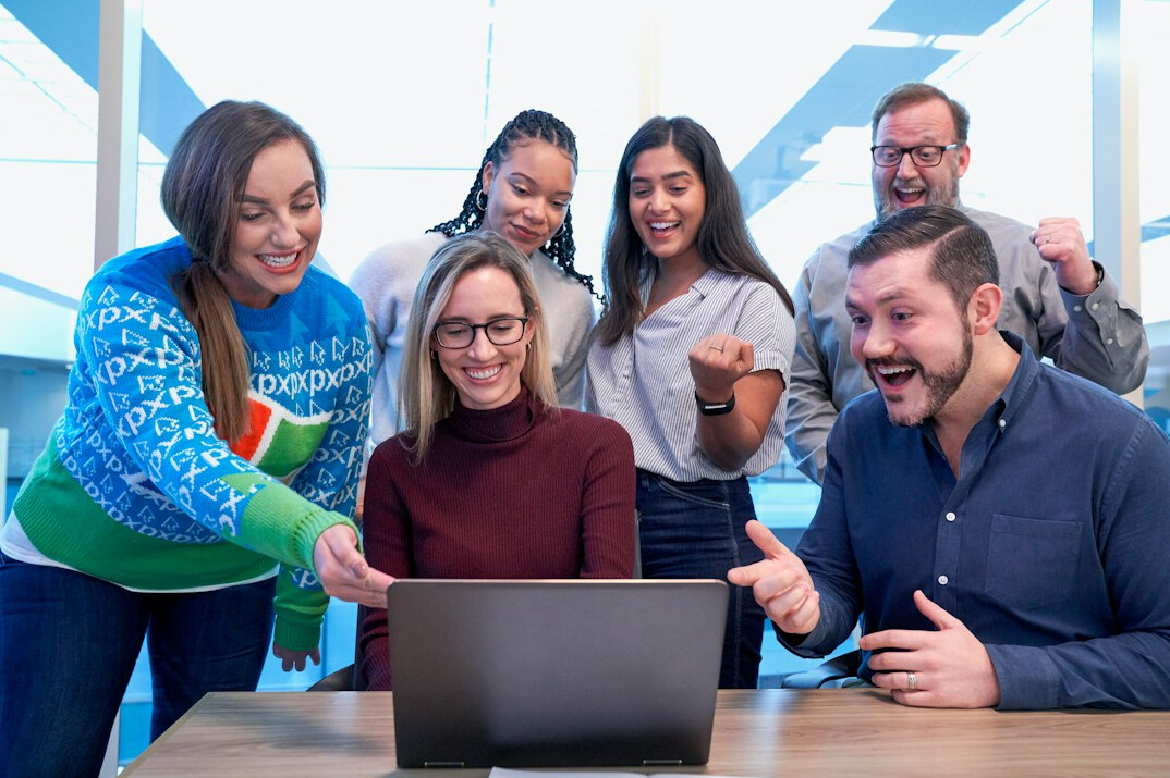 diverse students coding together