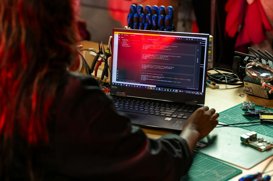 woman coding on computer